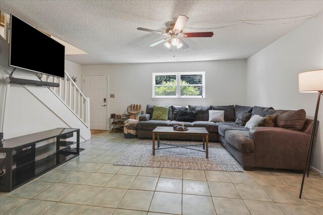 1520 Pullen Rd Unit 6, Tallahassee, FL 32303 - living area with stairs, ceiling fan, a textured ceiling, and light tile patterned floors