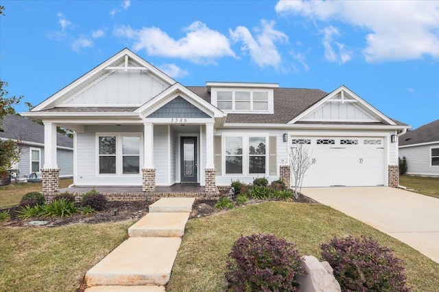 craftsman inspired home featuring a garage and a front yard