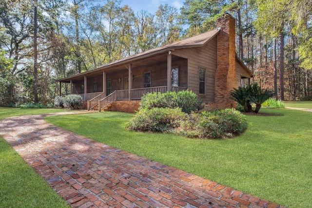 view of front of property with a porch and a front yard