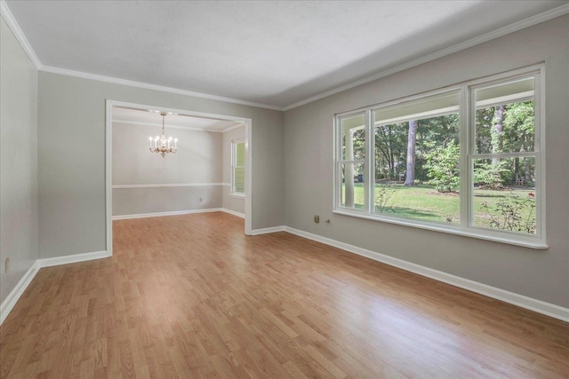 unfurnished room with baseboards, a chandelier, and light wood finished floors
