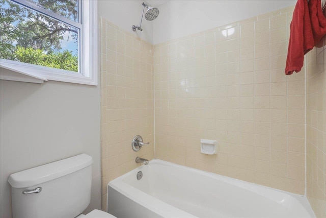 bathroom with bathtub / shower combination and toilet