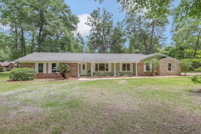 ranch-style home with a front lawn