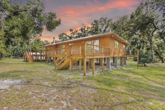 16552 198th Trace, Trace, FL 32071 - rear view of property featuring a wooden deck, stairs, and a lawn