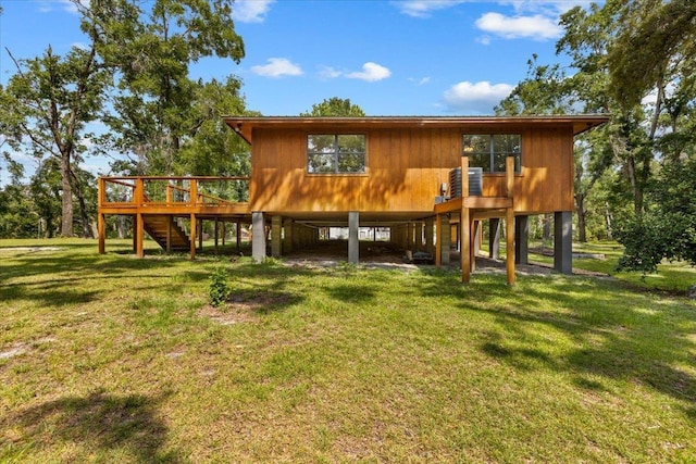 16552 198th Trace, Trace, FL 32071 - rear view of property with stairway, a wooden deck, a yard, and a carport