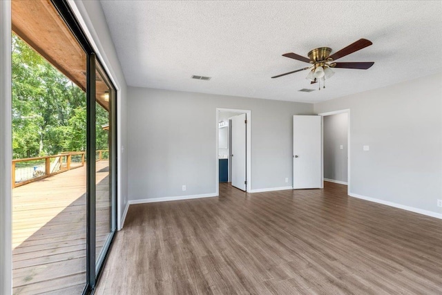 16552 198th Trace, Trace, FL 32071 - unfurnished room with wood finished floors, a ceiling fan, and a textured ceiling