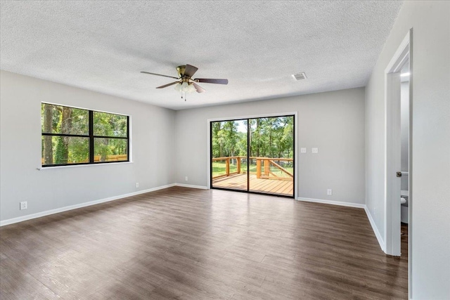 16552 198th Trace, Trace, FL 32071 - spare room with dark wood-style flooring, a ceiling fan, and a textured ceiling