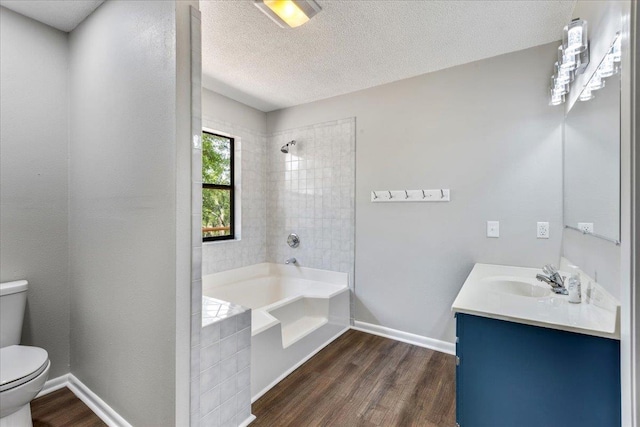 16552 198th Trace, Trace, FL 32071 - full bathroom featuring vanity, wood finished floors,  shower combination, and a textured ceiling
