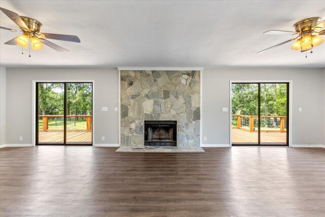16552 198th Trace, Trace, FL 32071 - unfurnished living room with a ceiling fan, dark wood finished floors, and a fireplace