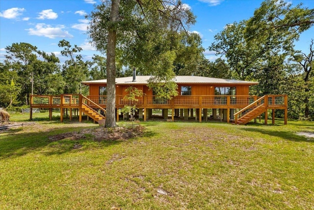 16552 198th Trace, Trace, FL 32071 - back of property featuring stairway, a wooden deck, and a lawn
