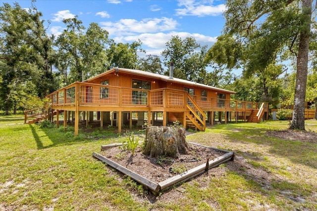 16552 198th Trace, Trace, FL 32071 - back of house with stairway, a lawn, and a deck