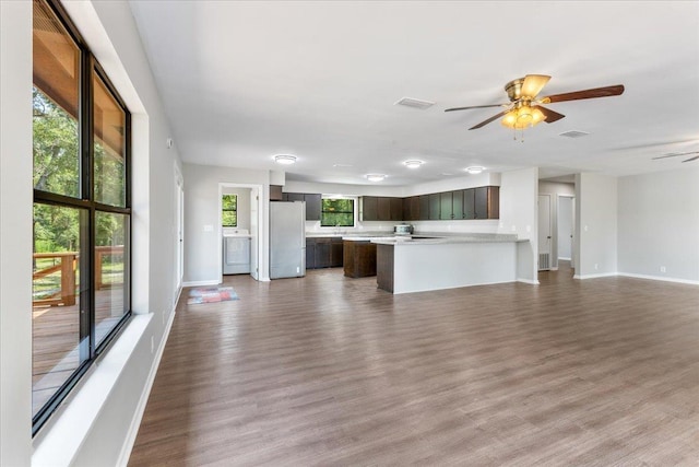 16552 198th Trace, Trace, FL 32071 - unfurnished living room with wood finished floors, ceiling fan, and washer / clothes dryer