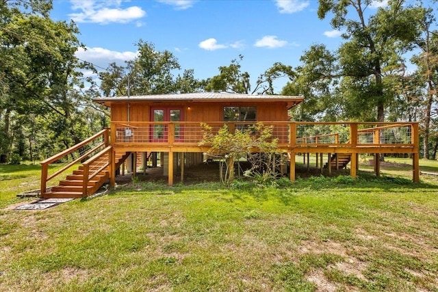 16552 198th Trace, Trace, FL 32071 - back of house with stairway, a deck, a lawn, and a metal roof