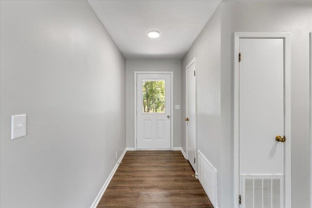 16552 198th Trace, Trace, FL 32071 - doorway featuring dark wood-type flooring and baseboards