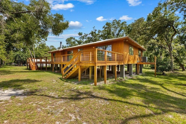 16552 198th Trace, Trace, FL 32071 - rear view of property featuring a lawn, stairs, and a wooden deck