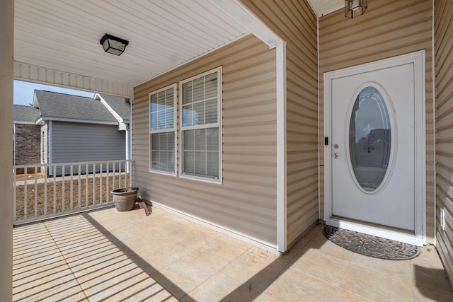 property entrance featuring covered porch