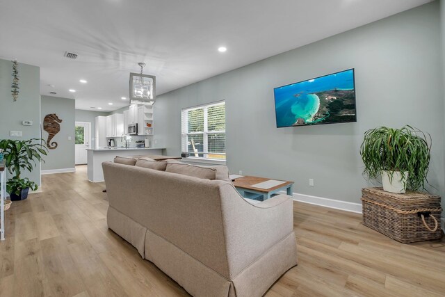 131 Delaware St, Carrabelle, FL 32323 - living area featuring light wood-type flooring and recessed lighting