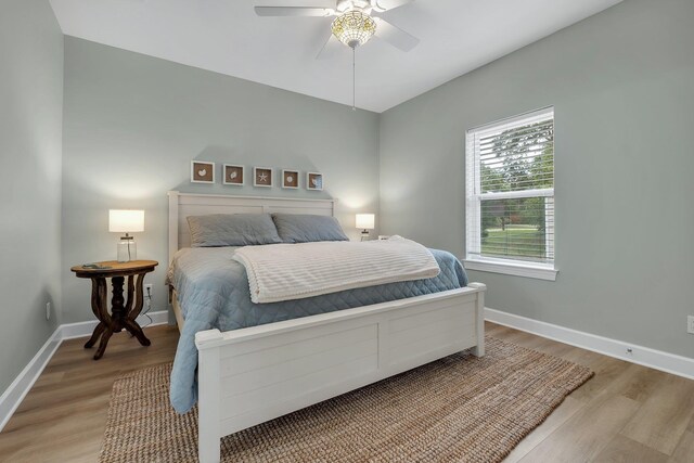 131 Delaware St, Carrabelle, FL 32323 - bedroom featuring light wood-style flooring and a ceiling fan