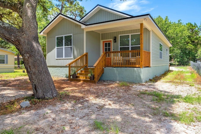 131 Delaware St, Carrabelle, FL 32323 - view of front of property with a porch