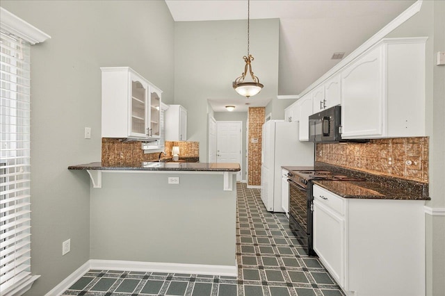 2032 Ascot Way, Tallahassee, FL 32312 - kitchen with black appliances, dark floors, a peninsula, glass insert cabinets, and white cabinets