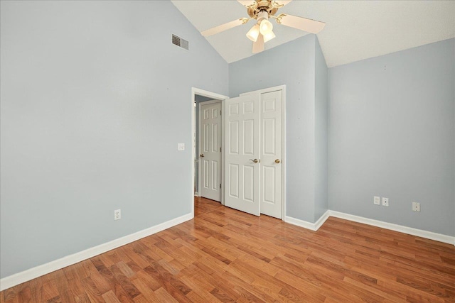 2032 Ascot Way, Tallahassee, FL 32312 - unfurnished bedroom with light wood-style flooring, high vaulted ceiling, and ceiling fan