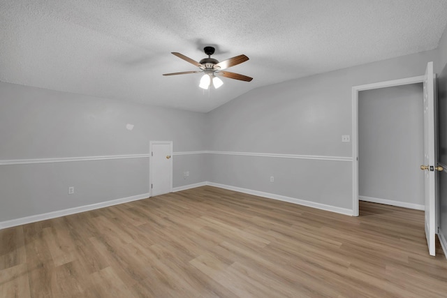 1997 Maymeadow Ln, Tallahassee, FL 32303 - spare room with ceiling fan, a textured ceiling, light wood-style floors, baseboards, and lofted ceiling