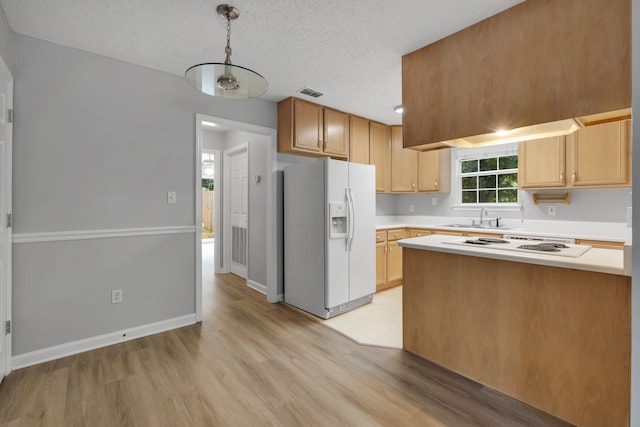 1997 Maymeadow Ln, Tallahassee, FL 32303 - kitchen with white appliances, a sink, light countertops, light wood-type flooring, and a textured ceiling
