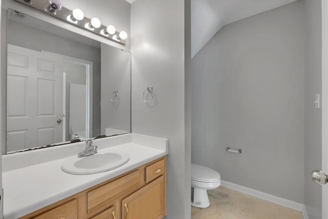 1997 Maymeadow Ln, Tallahassee, FL 32303 - bathroom with toilet, vanity, baseboards, and tile patterned flooring