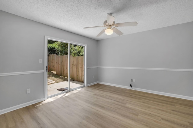 1997 Maymeadow Ln, Tallahassee, FL 32303 - empty room with wood finished floors, a textured ceiling, ceiling fan, and baseboards