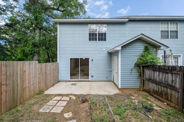 1997 Maymeadow Ln, Tallahassee, FL 32303 - back of property featuring a patio and a fenced backyard