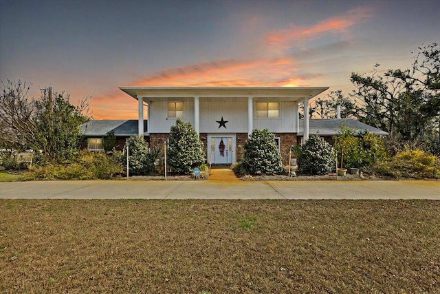 view of front of home with a lawn