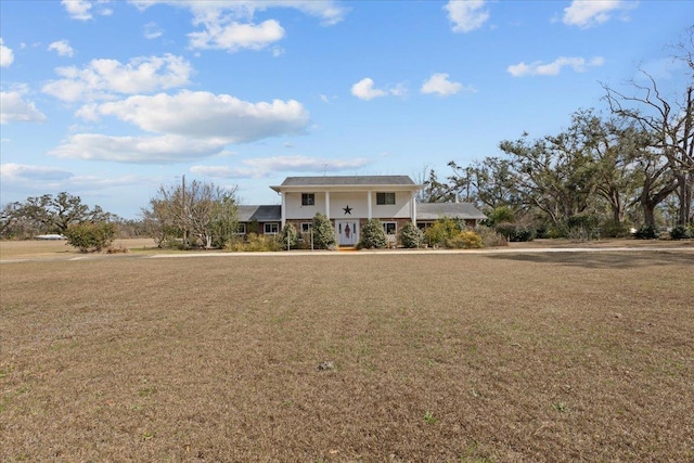 view of property with a front lawn