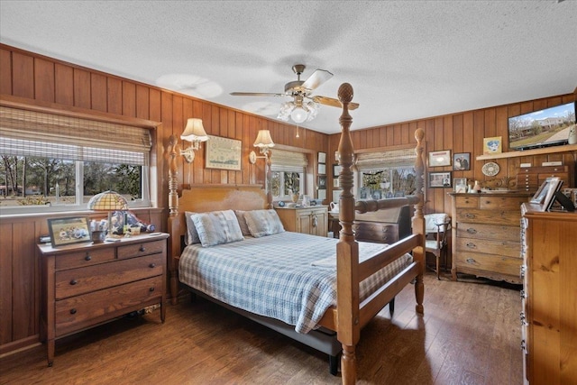 bedroom featuring hardwood / wood-style floors and a textured ceiling