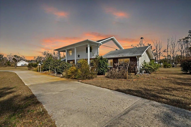 view of front of property with a lawn