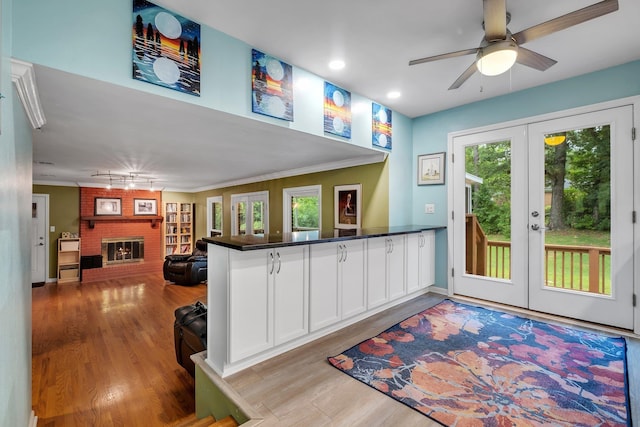 3514 Tullamore Ln, Tallahassee, FL 32309 - kitchen featuring french doors, plenty of natural light, wood finished floors, white cabinetry, and recessed lighting