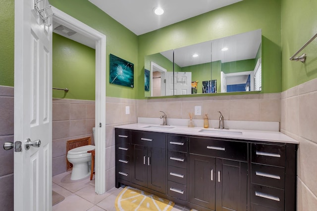 3514 Tullamore Ln, Tallahassee, FL 32309 - full bathroom with tile walls, tile patterned floors, double vanity, and a wainscoted wall