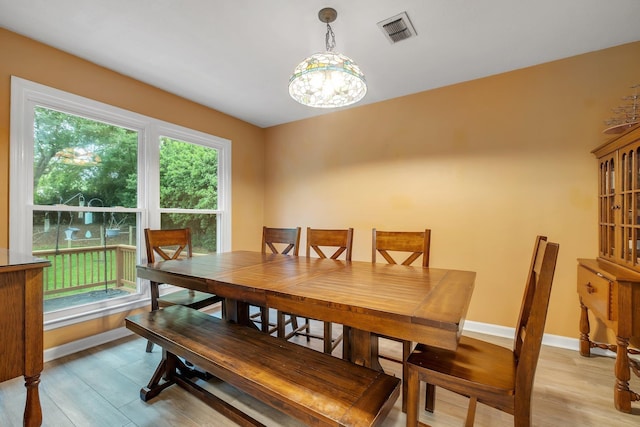 3514 Tullamore Ln, Tallahassee, FL 32309 - dining room with light wood-type flooring and a chandelier