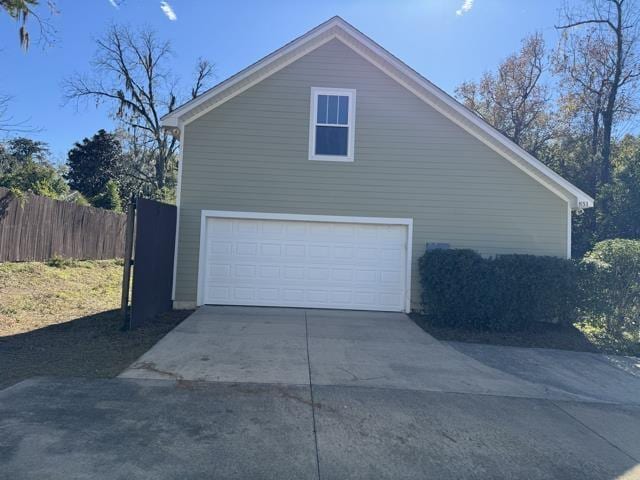 view of side of home with a garage