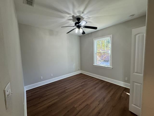 empty room with dark wood-type flooring