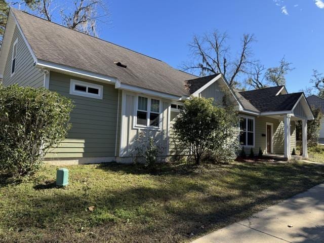 view of home's exterior with a yard