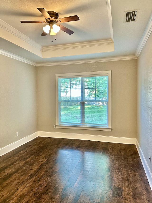 3646 Homestead Rd, Tallahassee, FL 32309 - empty room featuring a raised ceiling, wood-type flooring, ornamental molding, and ceiling fan