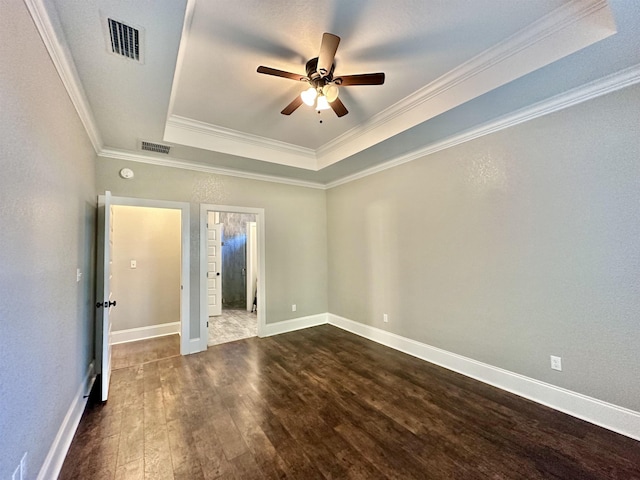 3646 Homestead Rd, Tallahassee, FL 32309 - unfurnished bedroom with a raised ceiling, dark wood-style floors, ornamental molding, baseboards, and ceiling fan