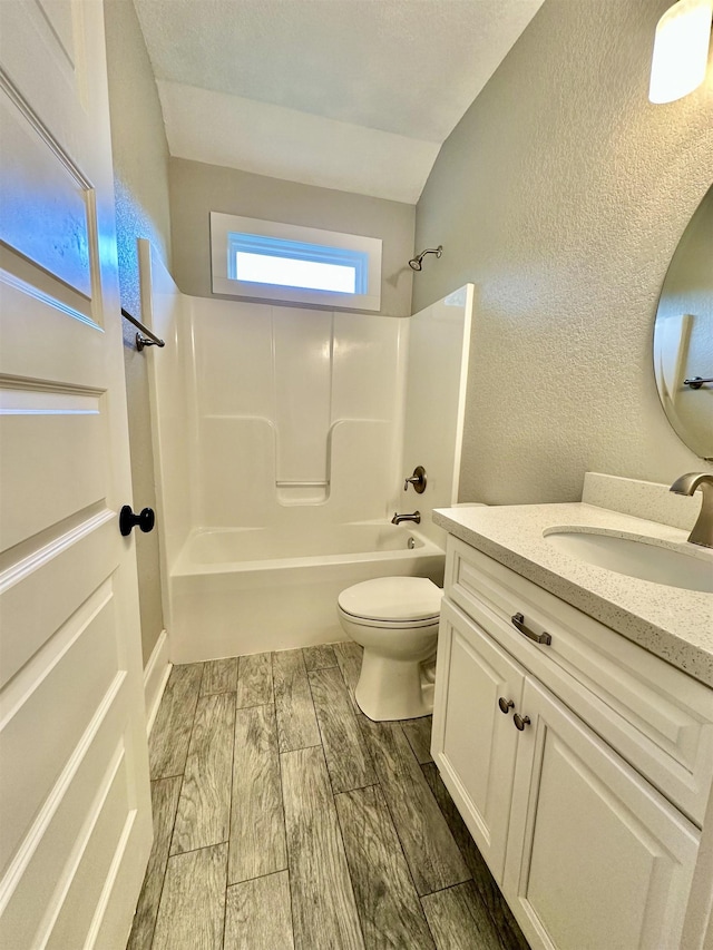 3646 Homestead Rd, Tallahassee, FL 32309 - bathroom featuring washtub / shower combination, a textured wall, toilet, vanity, and wood finished floors