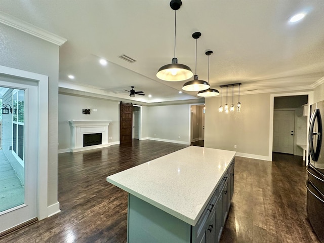 3646 Homestead Rd, Tallahassee, FL 32309 - kitchen with freestanding refrigerator, ornamental molding, dark wood-style flooring, recessed lighting, and a center island