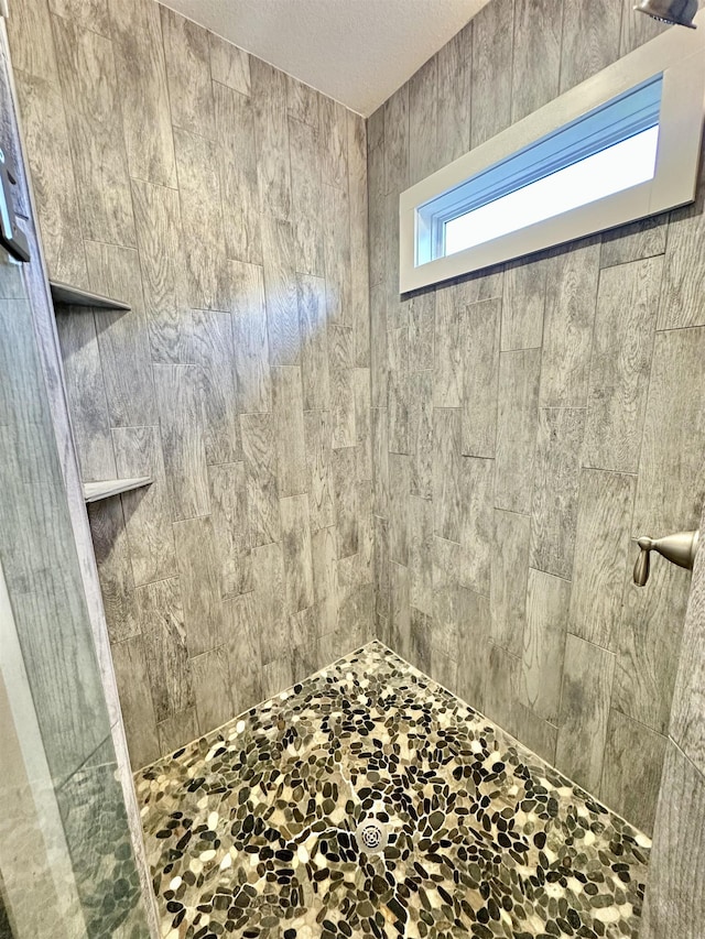 3646 Homestead Rd, Tallahassee, FL 32309 - full bathroom with tiled shower and a textured ceiling