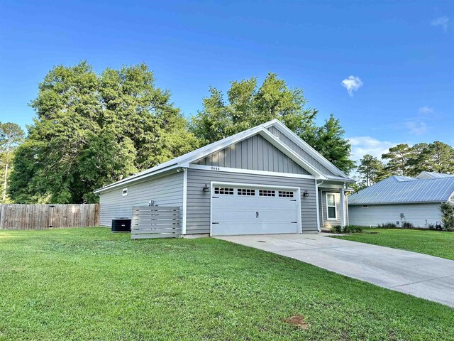 3646 Homestead Rd, Tallahassee, FL 32309 - view of property exterior featuring board and batten siding and concrete driveway