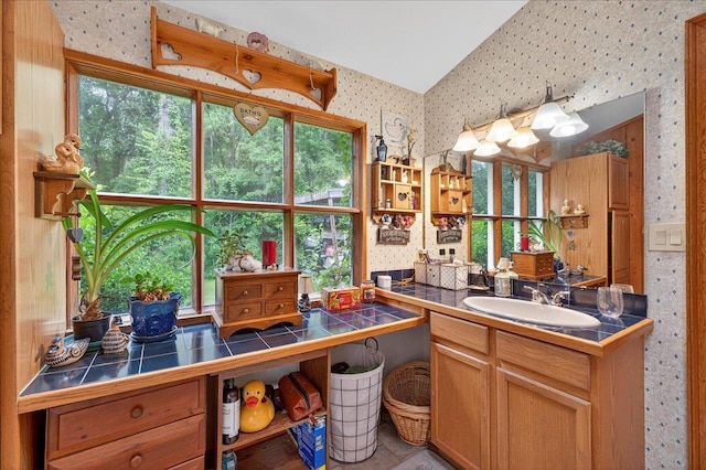39 Wiregrass Ln, Quincy, FL 32351 - kitchen with wallpapered walls, tile countertops, and open shelves