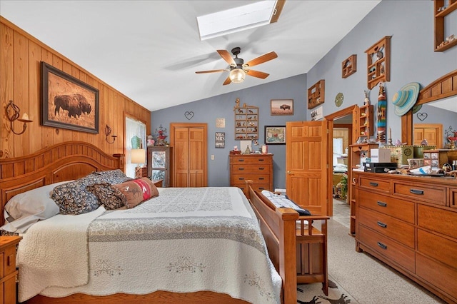 39 Wiregrass Ln, Quincy, FL 32351 - bedroom featuring lofted ceiling, carpet, a skylight, wood walls, and ceiling fan