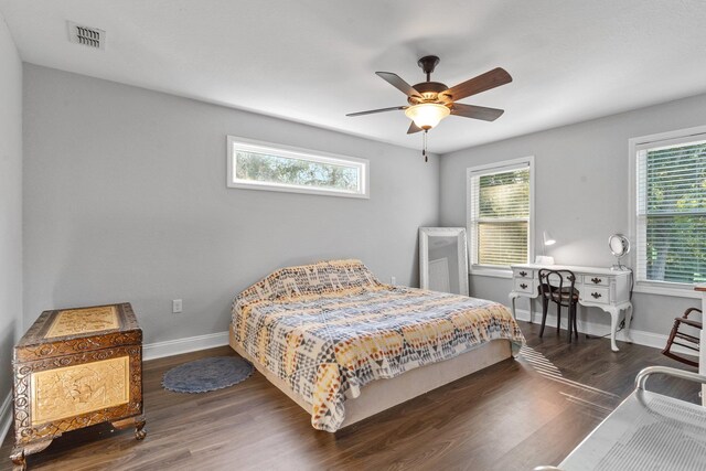 bedroom with dark wood-type flooring and ceiling fan