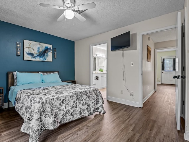 bedroom featuring a textured ceiling, connected bathroom, hardwood / wood-style flooring, and ceiling fan