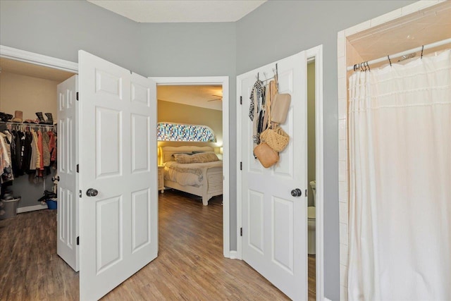 hallway with wood-type flooring